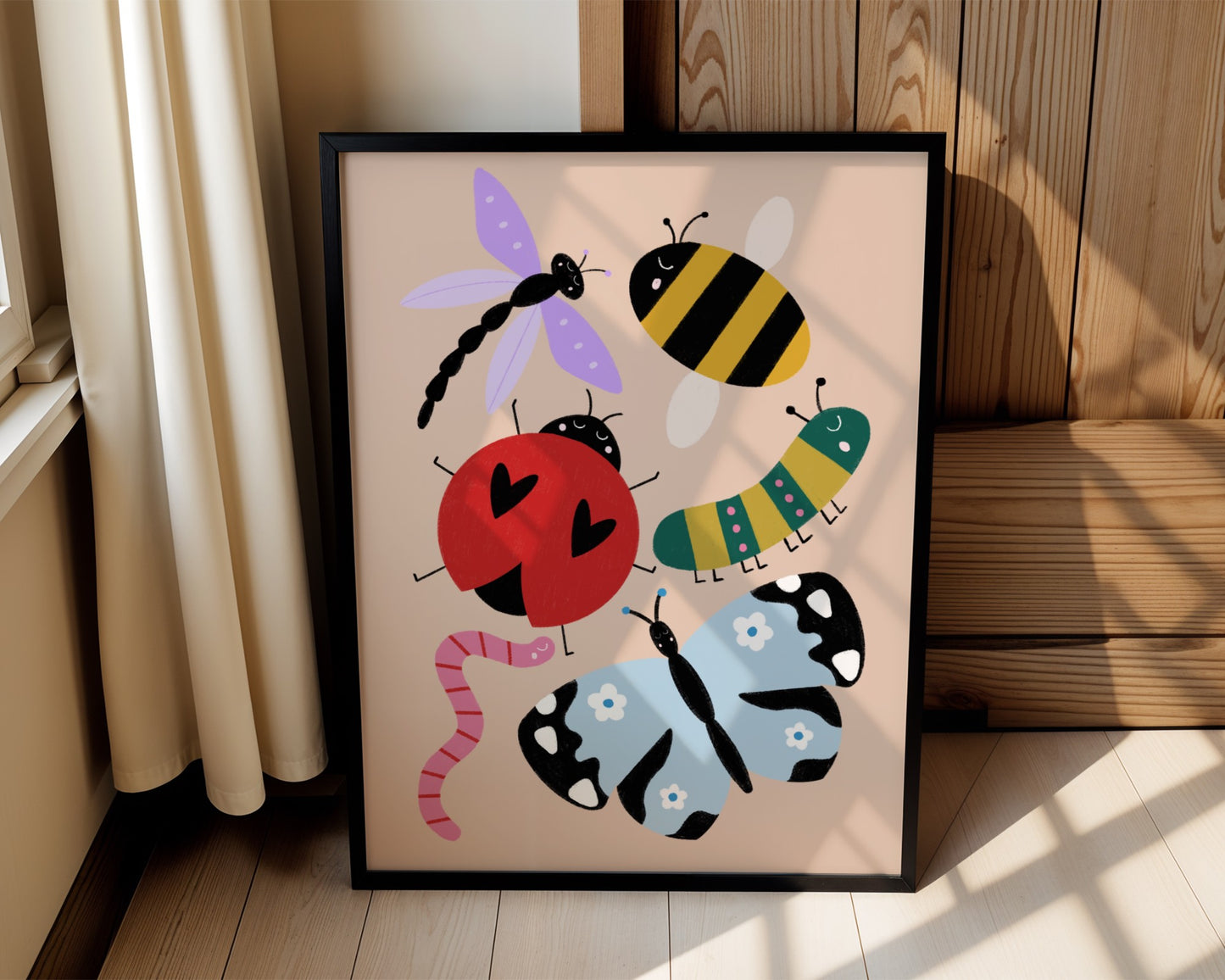 Kids wall art with beige background featuring bug illustrations of a pink and red worm, a blue butterfly, a red ladybird, a green and pink caterpillar, a bee and a purple dragonfly, all with cute faces.