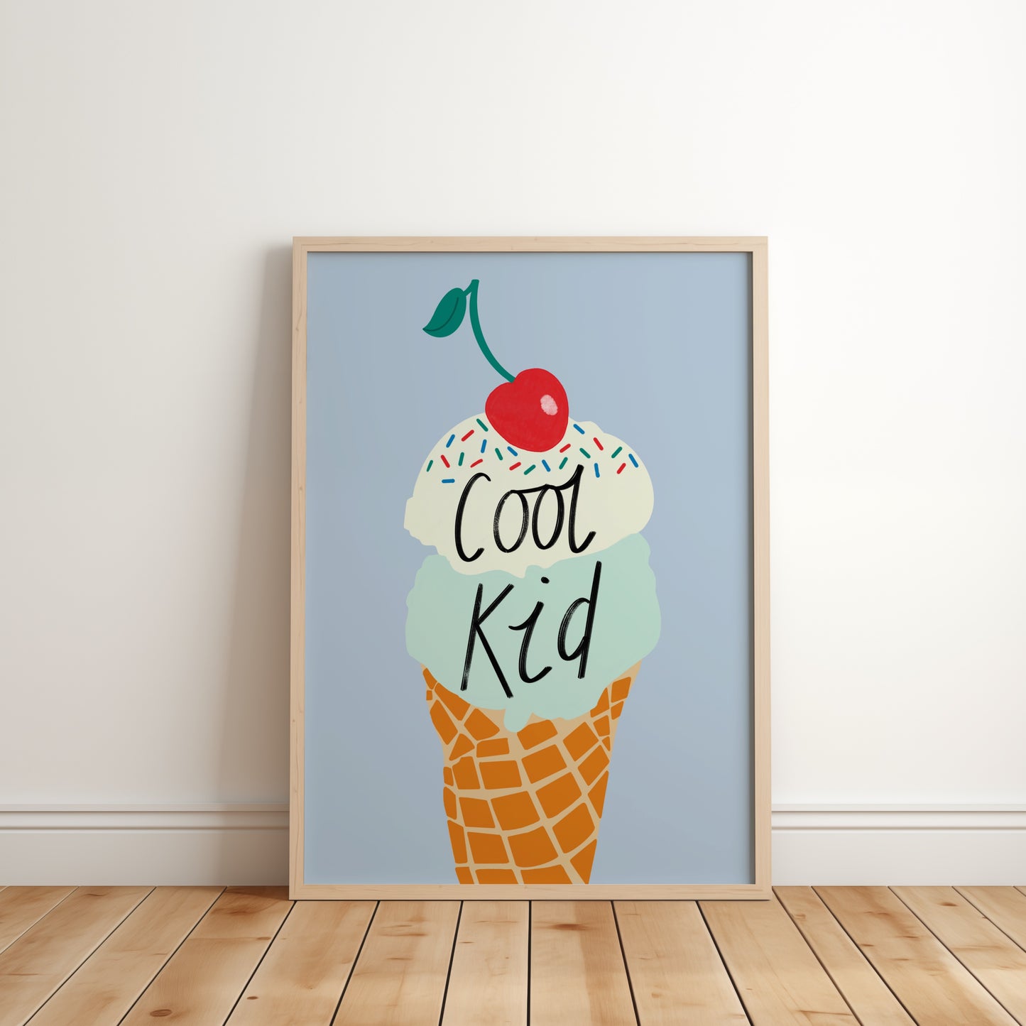 Kids wall art with blue background and mint and vanilla ice cream illustration with sprinkles and cherry on the top with the wording ‘cool kid’