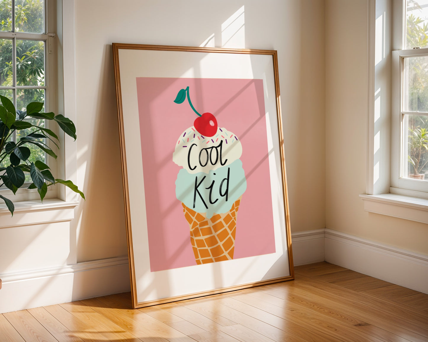 Kids wall art with pink background and mint and vanilla ice cream illustration with sprinkles and cherry on the top with the wording ‘cool kid’