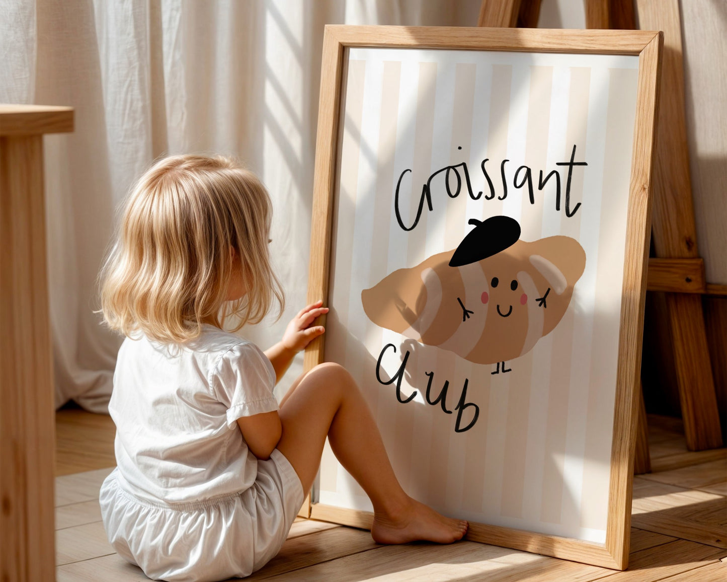 Cute kids wall art featuring striped background and a smiling croissant in a beret with the phrase croissant club in playful Lettering, perfect for nursery or playroom decor