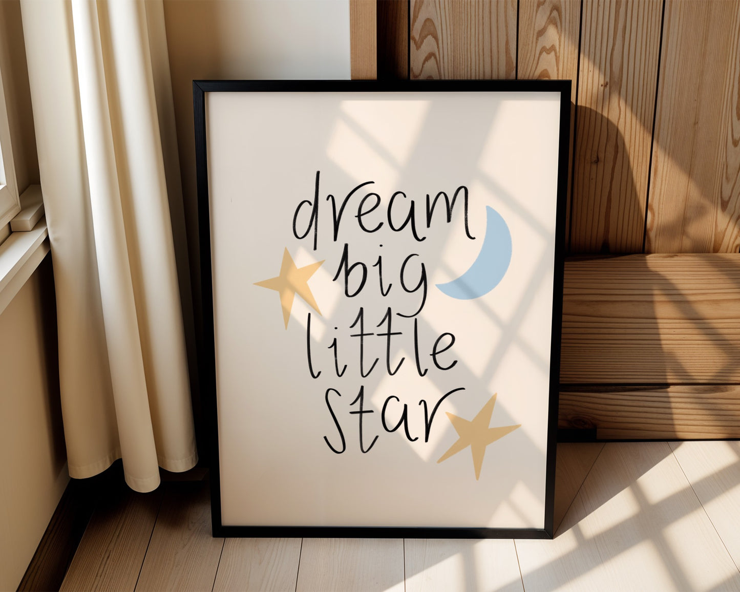 Cream nursery wall art with pale yellow stars and soft blue moon featuring the quote “dream big little star”