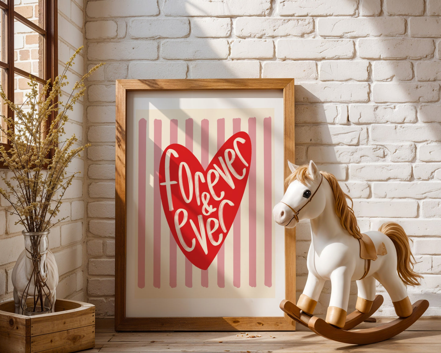 Wall art with pink striped background and bright red love heart illustration and handwritten words ‘forever & ever’
