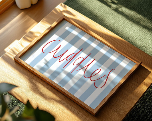 Kids wall art with blue striped background and red ‘Cuddles’ text