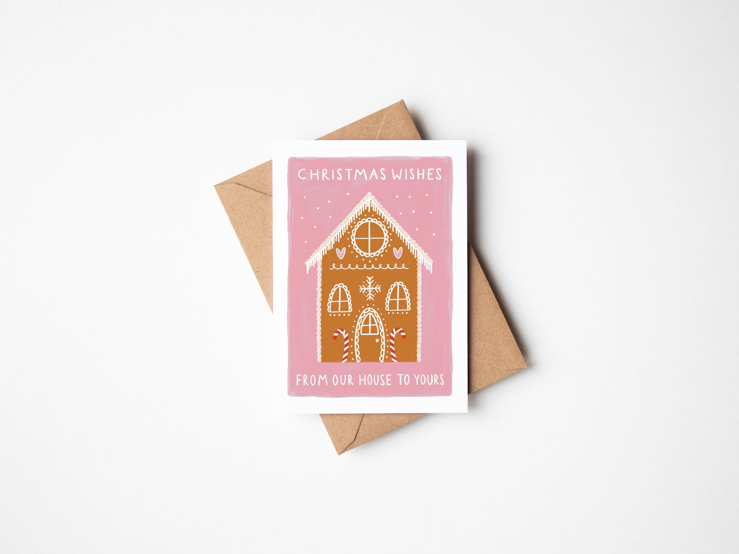 Christmas card with a house illustration and envelope on a white background
