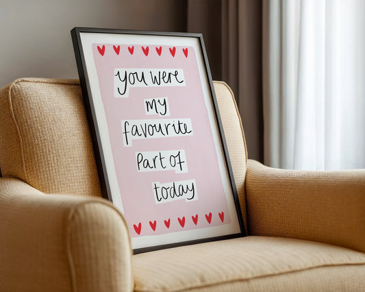 Framed quote on a pink background on a beige armchair