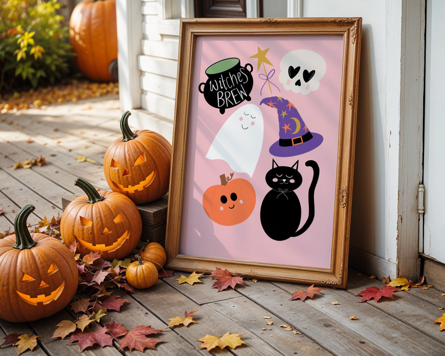 Halloween-themed framed print with pumpkins and ghosts on a wooden deck.