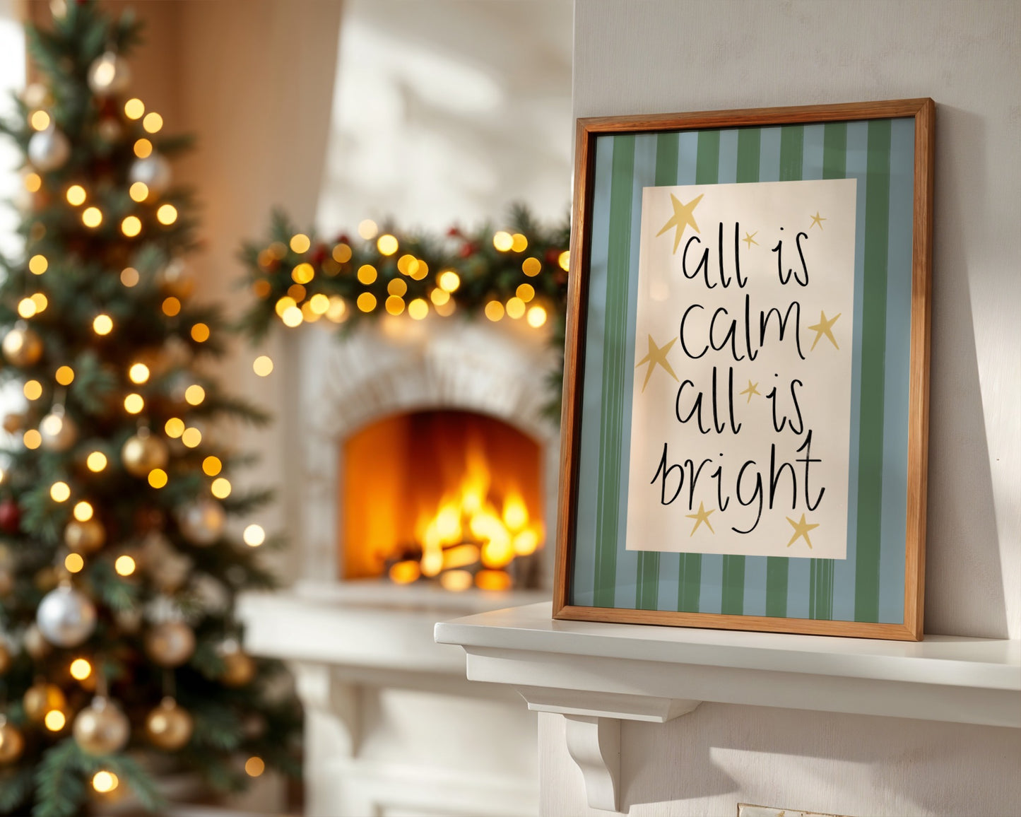 Framed Christmas sign on a mantelpiece with a decorated tree and fireplace in the background.
