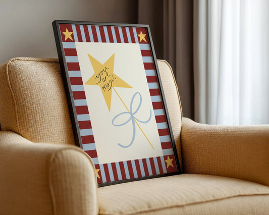 Decorative framed picture with stars and text on a beige couch