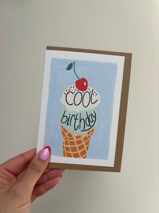 Blue birthday card includes mint and vanilla ice cream with sprinkles and cherry on the top with the wording ‘cool birthday’. Kraft envelope included.