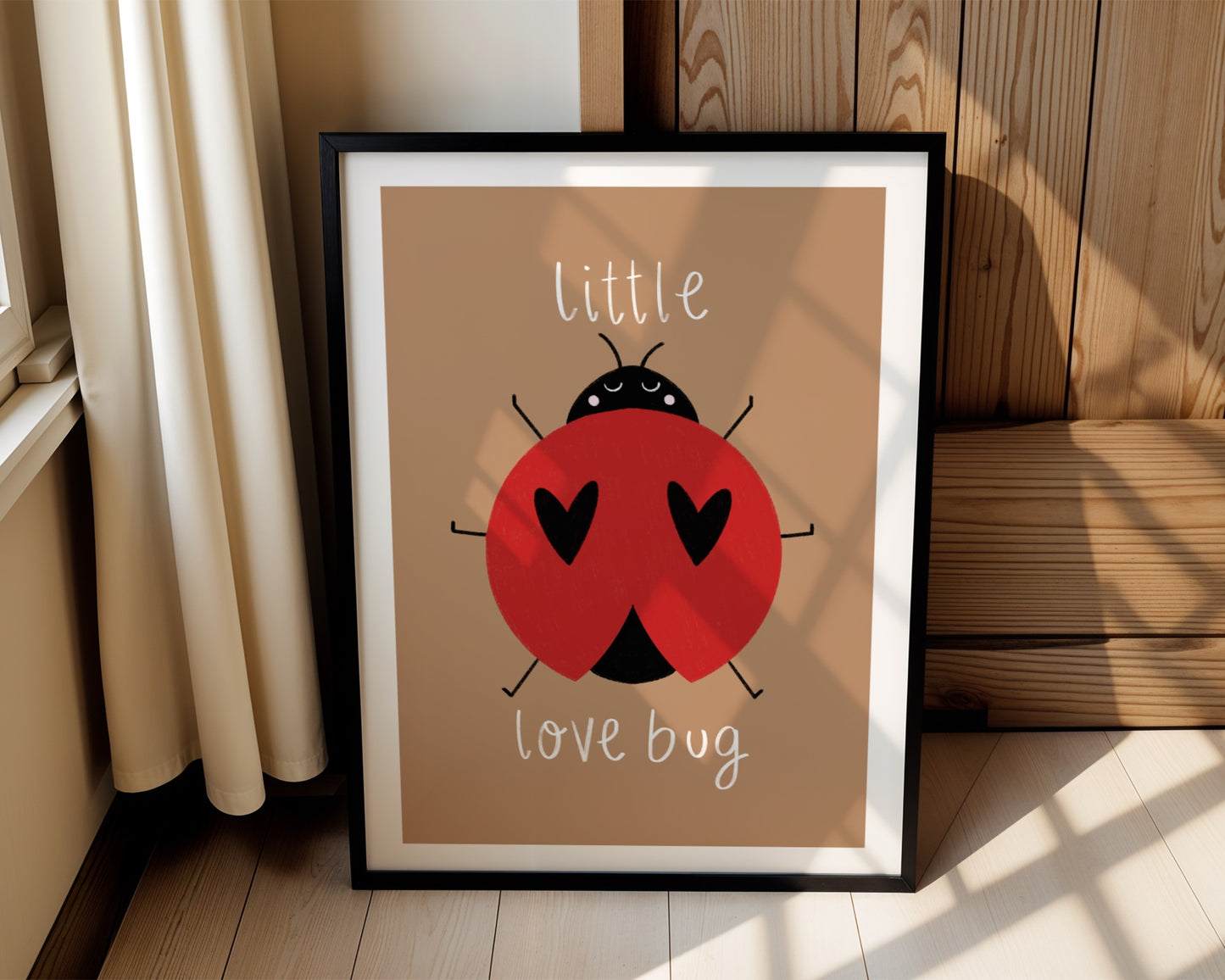 Kids wall art with pink background, a hand drawn illustration of a ladybird with face and the words “little love bug” In white handwritten text.
