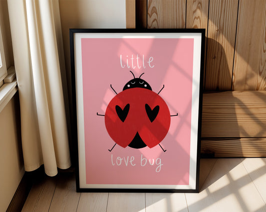 Kids wall art with pink background, a hand drawn illustration of a ladybird with face and the words “little love bug” In white handwritten text.
