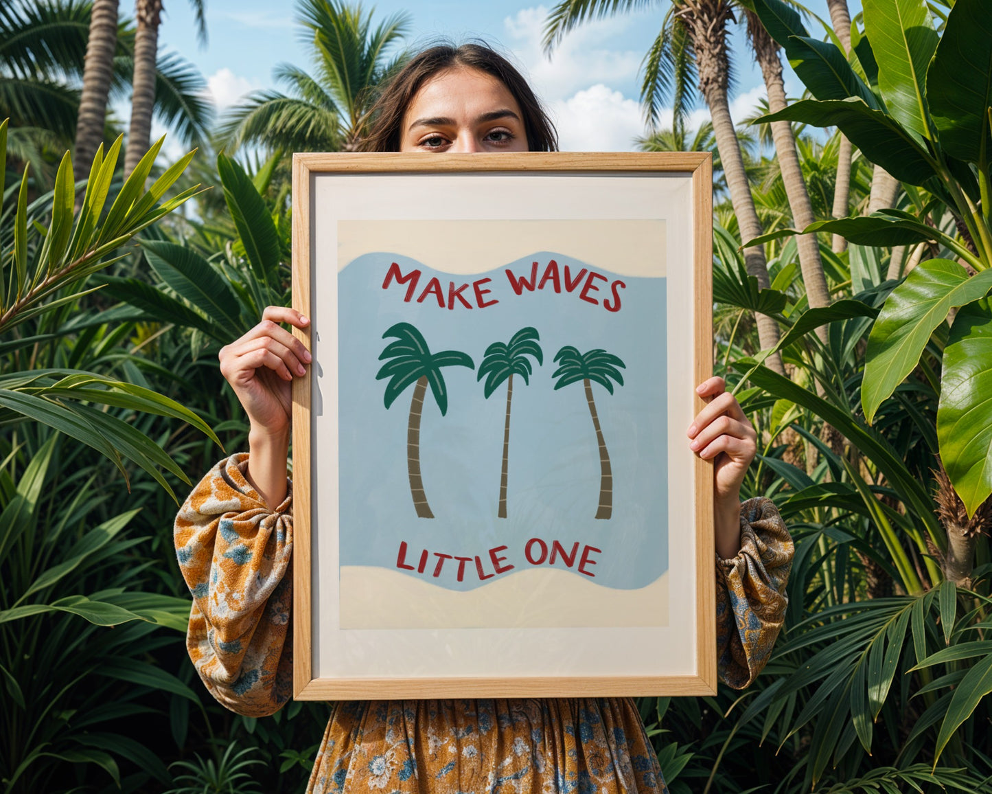 Kids beach themed wall art with blue background and three palm trees with wavy cream border and ‘make waves little one’ quote.
