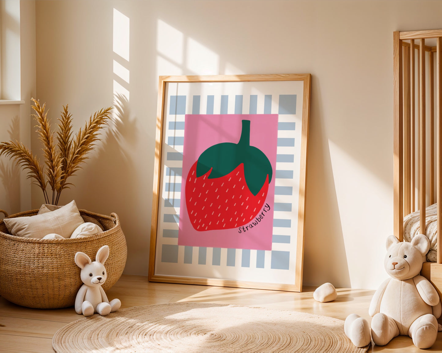 Kids wall art with blue and white striped border, dark pink centre and strawberry illustration with the hand written text ‘strawberry’.