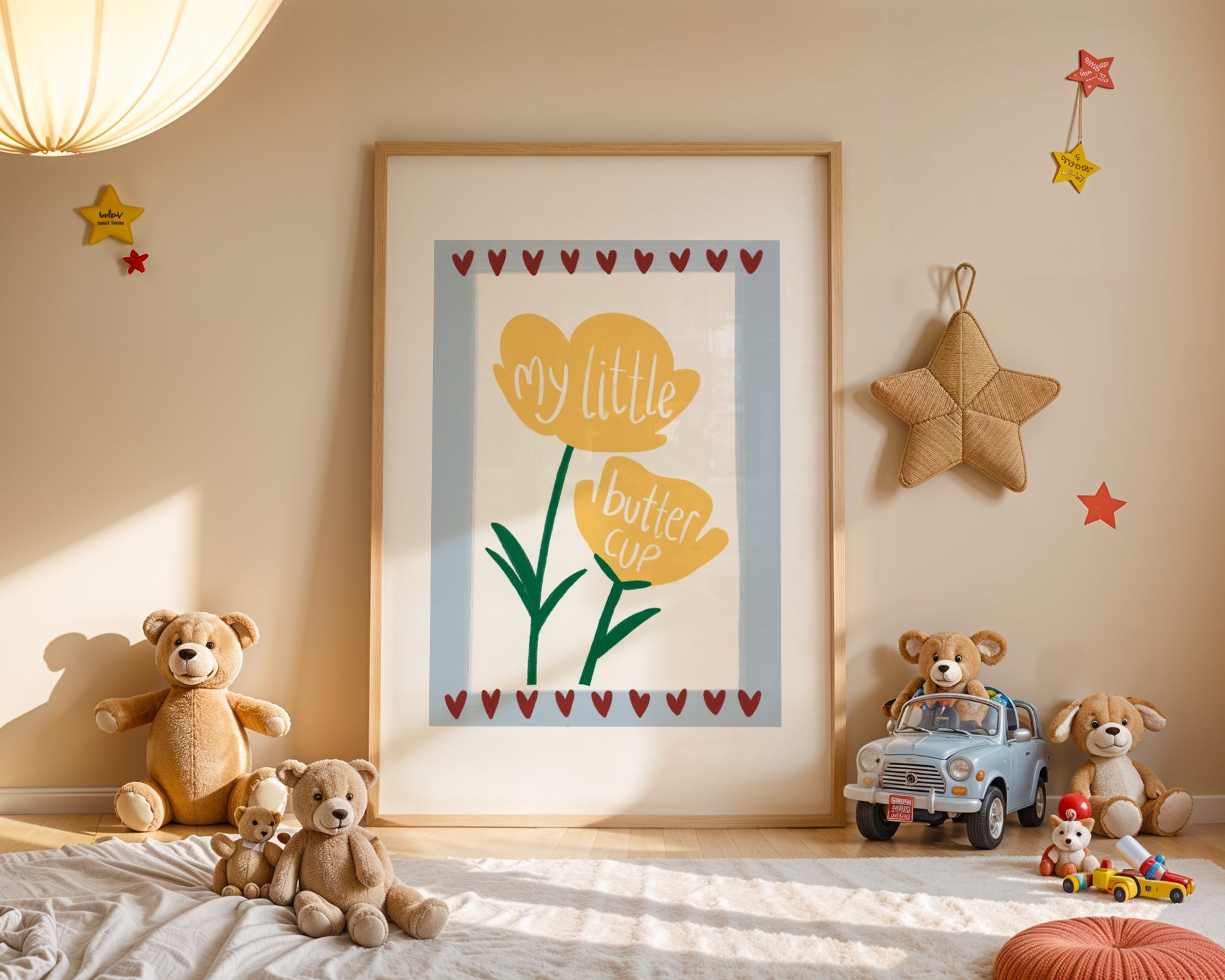 Kids wall print with white background,   light blue border and burgundy love hearts top and bottom with an illustration of two yellow buttercups and the words “my little buttercup”.