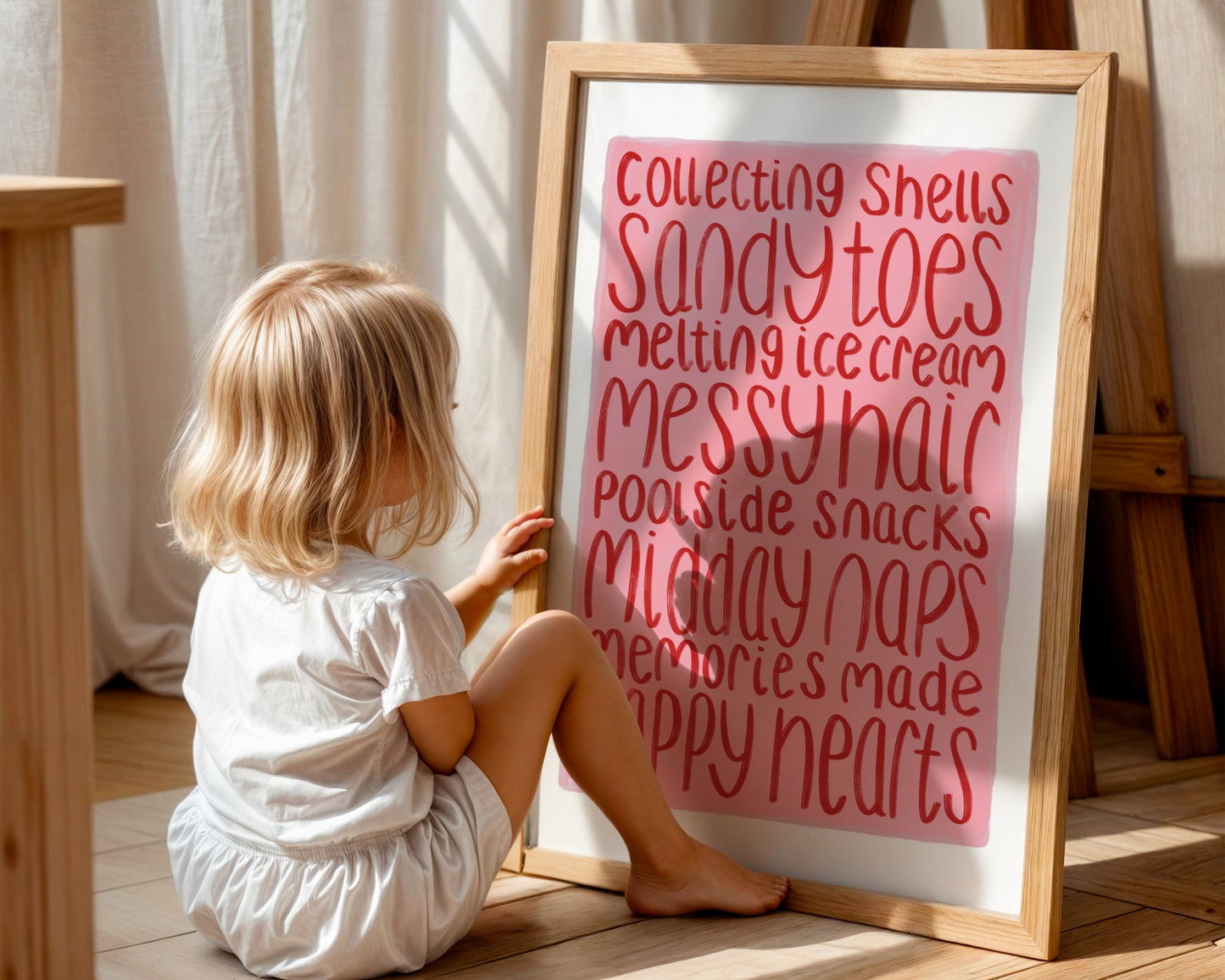 Kids wall art with white border, pink background and red text listing summer memories