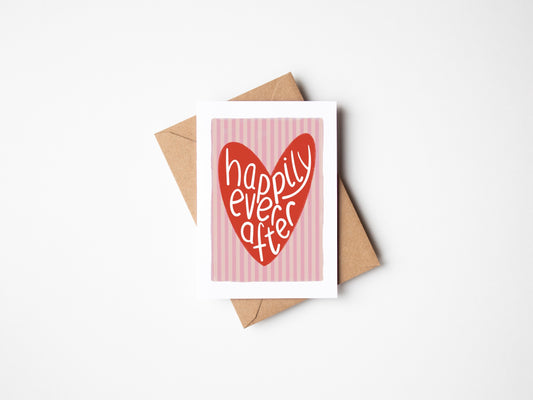 A6 recyclable premium card with white border, Pink striped wedding day card with red love heart with the wording “happily ever after” handwritten inside. Brown Kraft envelop included