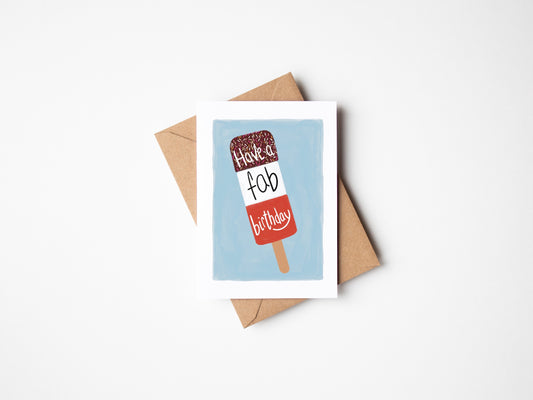 A6 premium textured recyclable greeting card with white border, blue background and a FAB ice lolly with the words “ have a fab birthday” in handwritten text. Brown Kraft envelope included. 