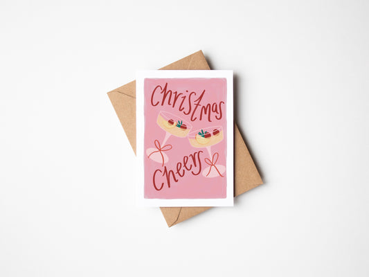 Greeting card with 'Christmas Cheers' text and a pink envelope on a white background