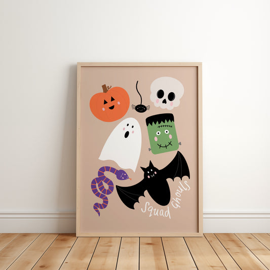 Kids Halloween wall art with the phrase squad ghouls featuring cute cartoon pumpkin, ghost, bat, skull, spider, snake, and Frankenstein’s monster 