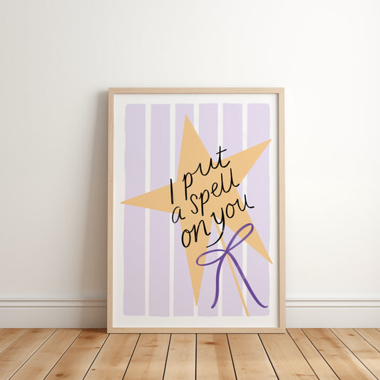 Framed artwork with a star design and text on a purple striped background, placed on a wooden floor.