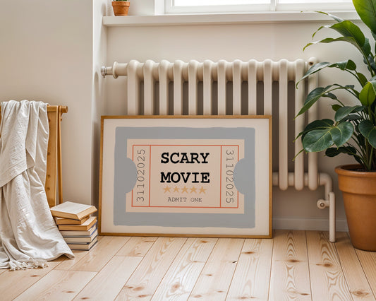 Framed 'Scary Movie' poster on a wooden floor with a radiator and plant in the background