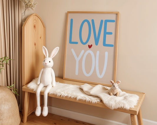 Wooden bench with plush rabbit toys and a framed picture reading 'Love You' on a beige wall.