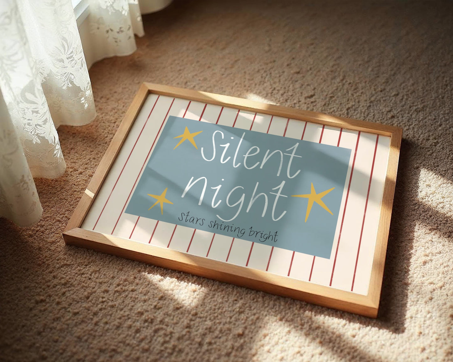 Framed sign with 'Silent Night' text on a carpeted floor