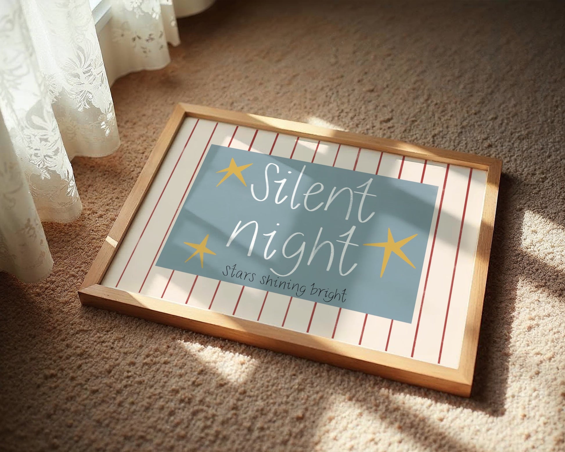 Framed sign with 'Silent Night' text on a carpeted floor