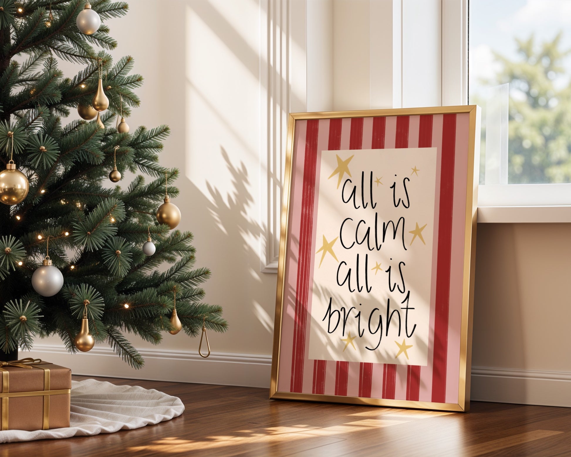 Framed Christmas-themed print with 'All is calm, all is bright' text next to a decorated Christmas tree.