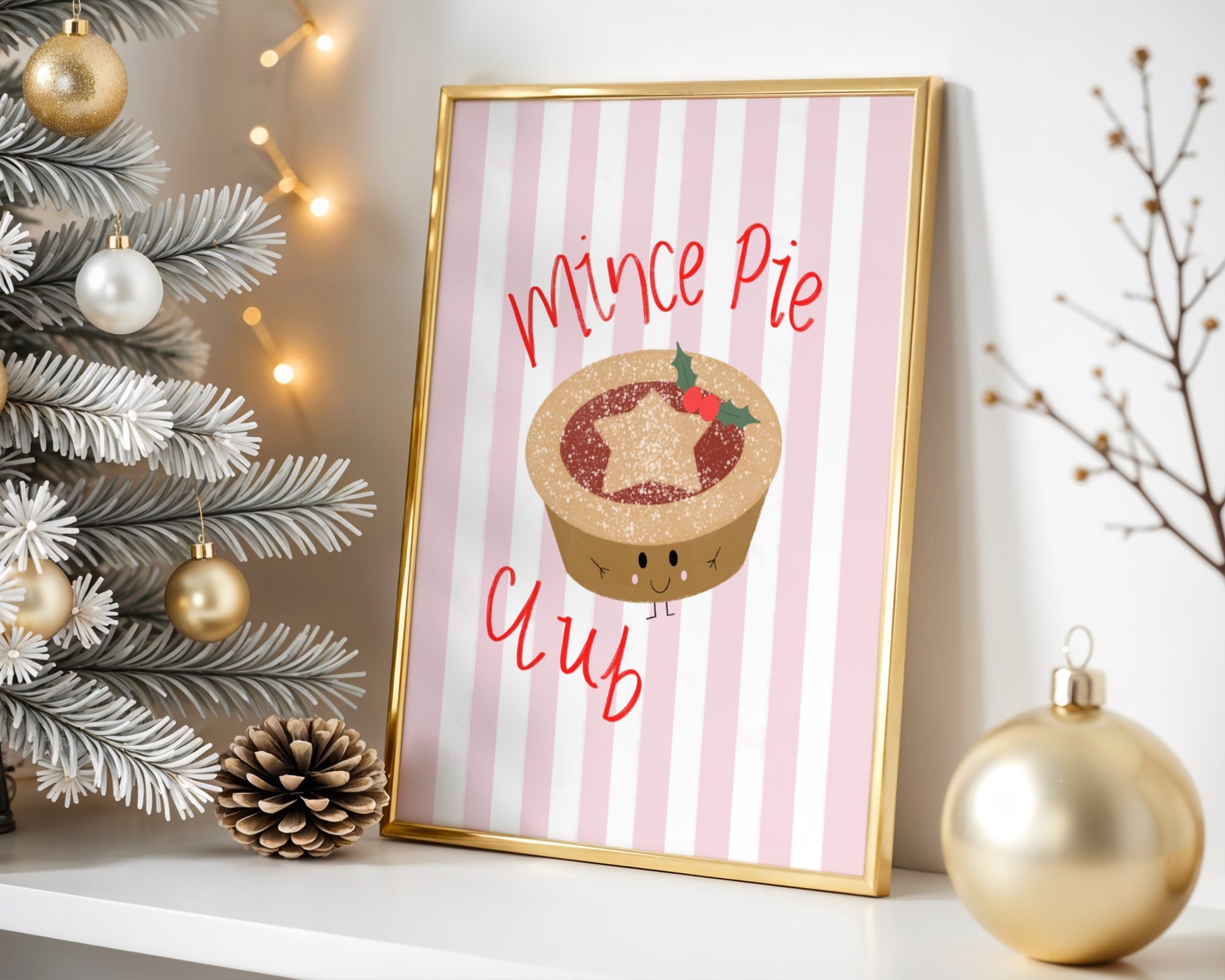 Framed artwork with a mince pie illustration and text, surrounded by Christmas decorations.