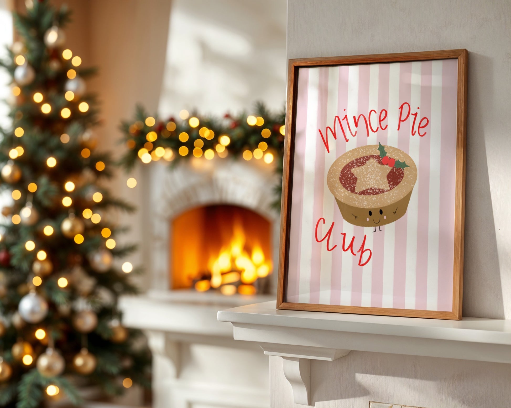 Framed 'Mince Pie Club' sign on a mantelpiece with Christmas tree and fireplace in the background