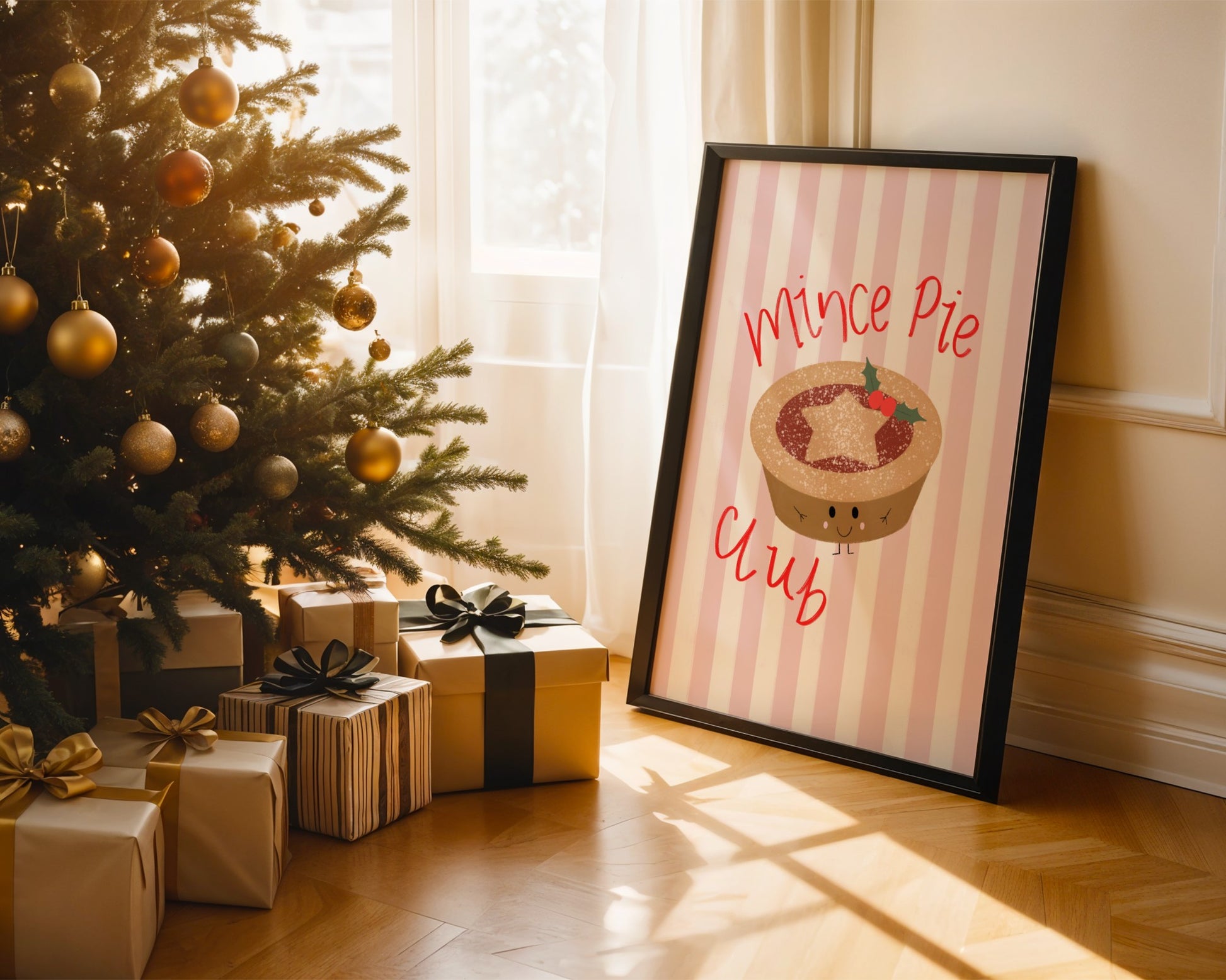 Framed picture of a mince pie with 'Mince Pie Club' text next to a decorated Christmas tree and presents.