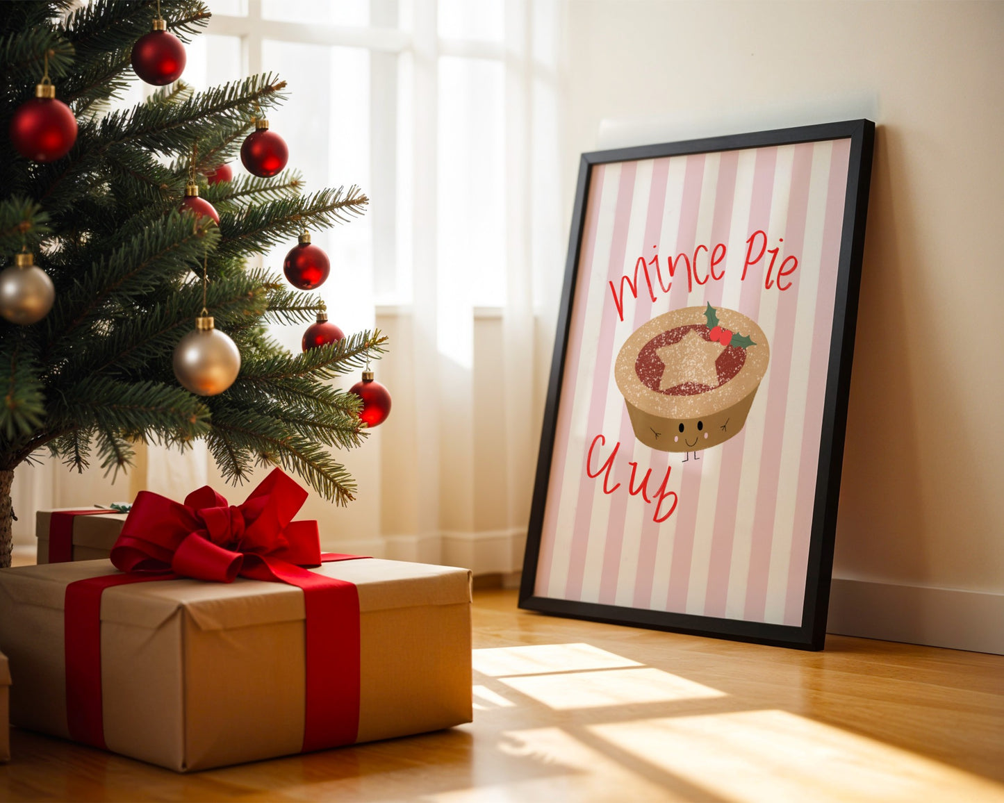 Framed picture of a mince pie with 'Mince Pie Club' text next to a Christmas tree and gift.