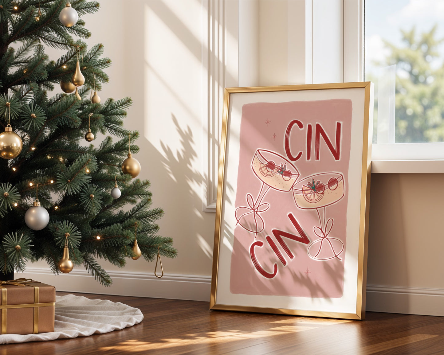 Framed artwork with 'CIN CIN' text next to a decorated Christmas tree.