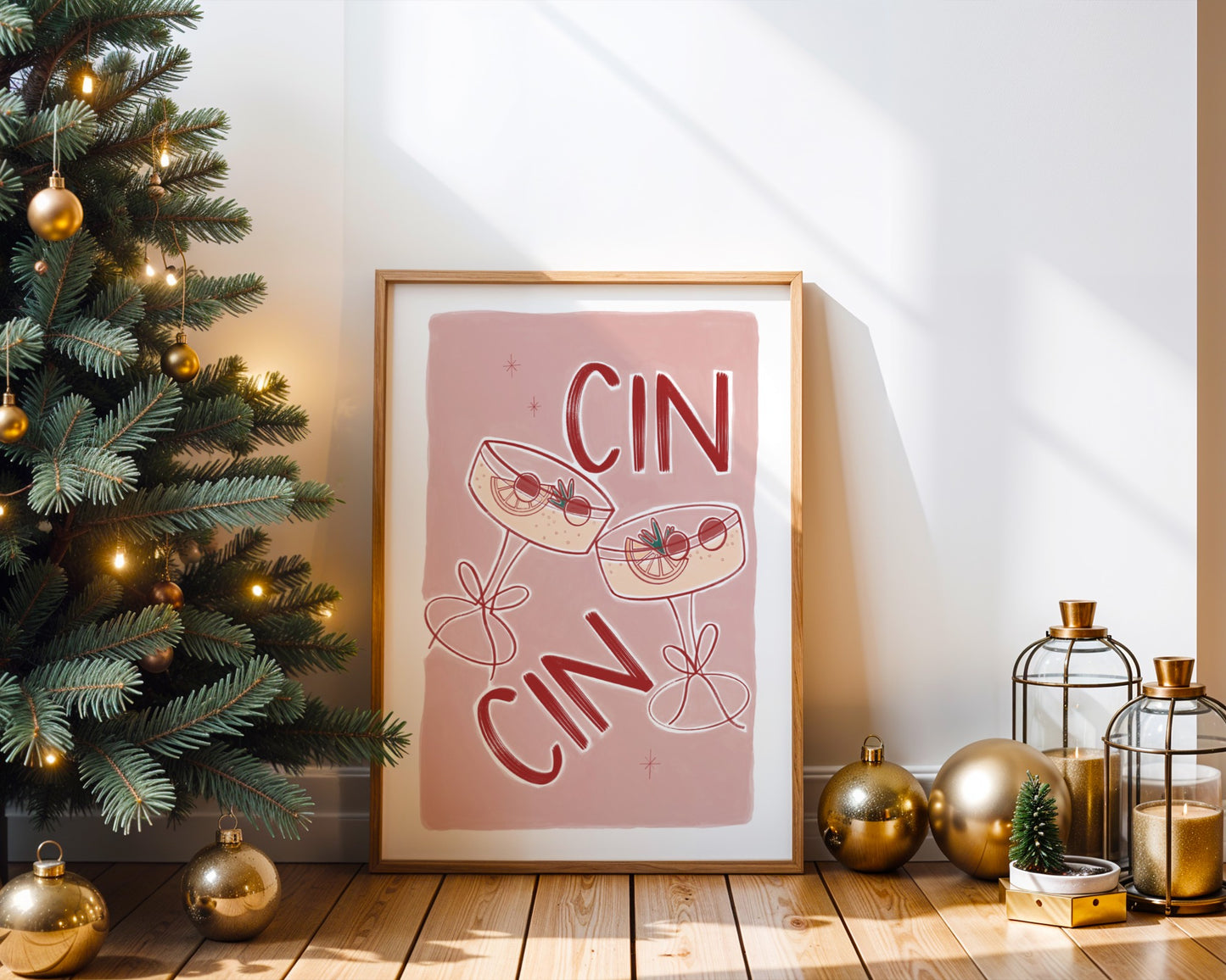 Framed art print with 'CIN' text next to a decorated Christmas tree.