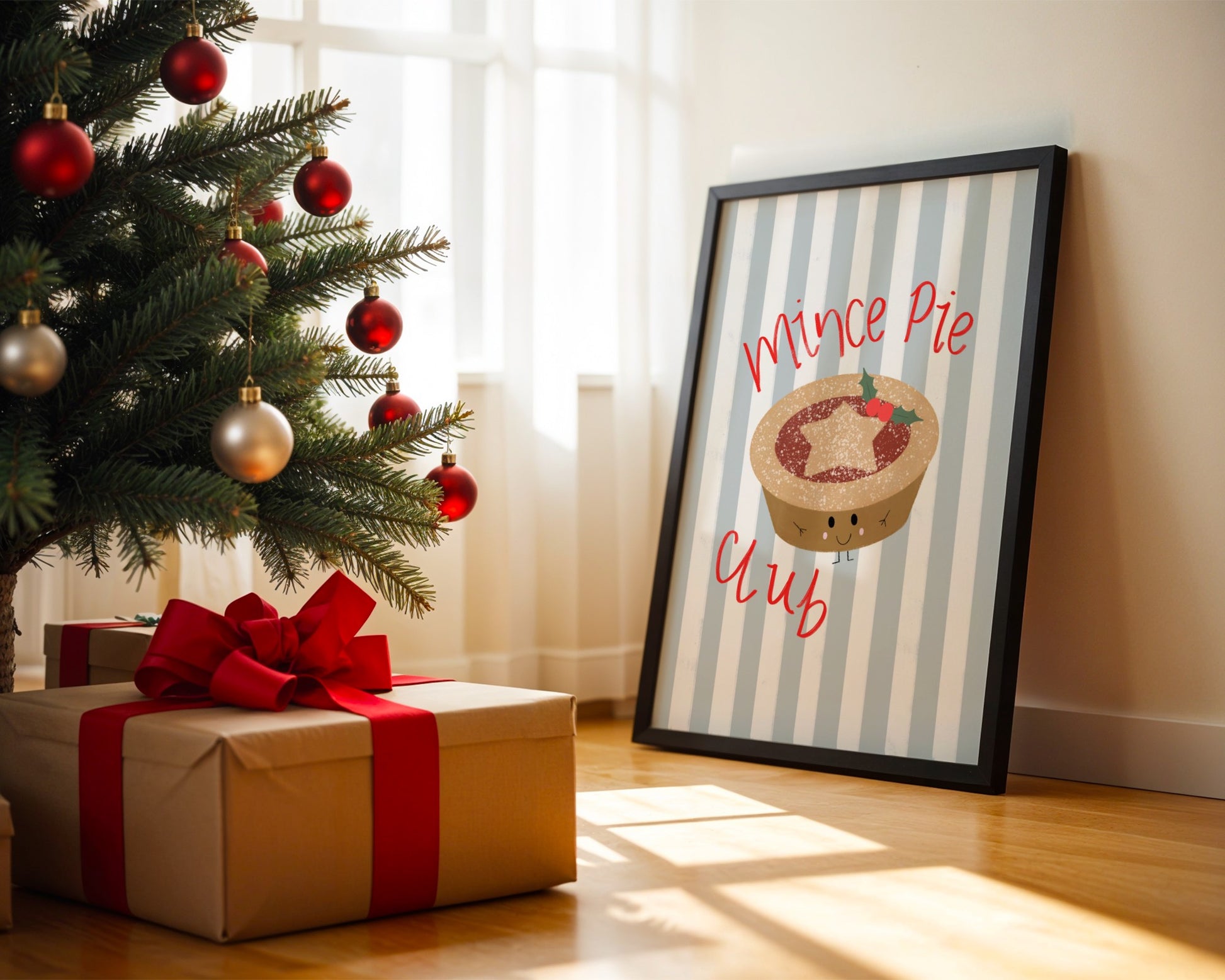 Framed picture of a mince pie with 'Mince Pie Club' text next to a Christmas tree and gift.