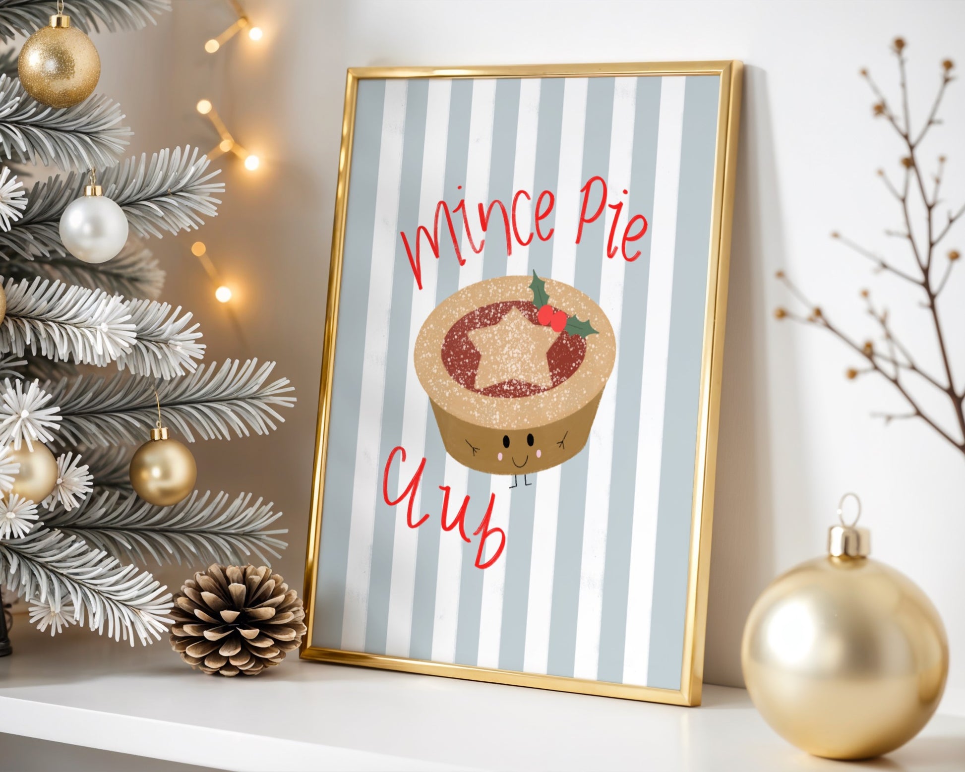 Framed artwork with 'Mince Pie' design next to a decorated Christmas tree.