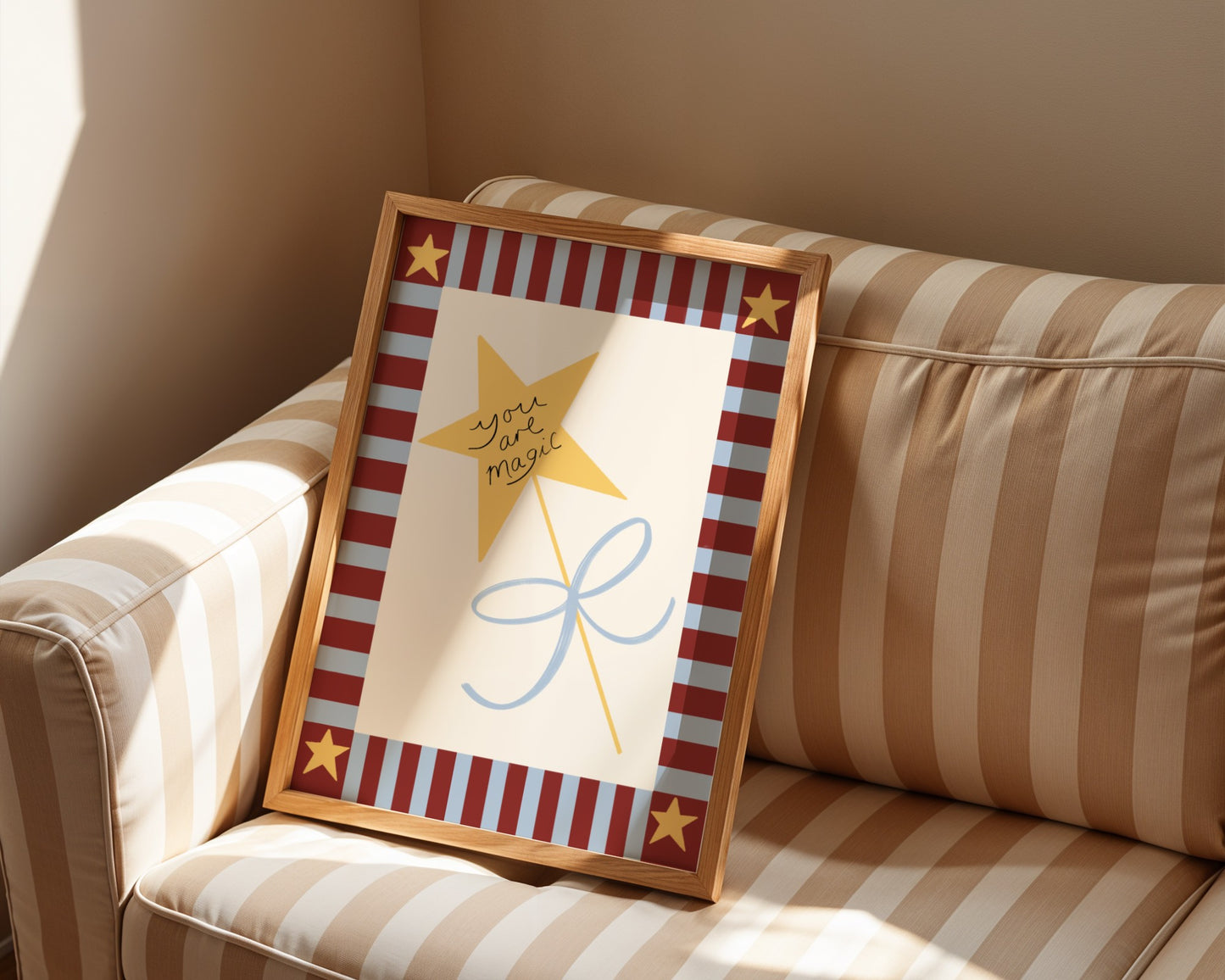 Framed artwork with a star and text on a striped couch
