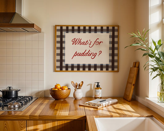 Kitchen with wooden countertop, stove, and decorative sign on wall.