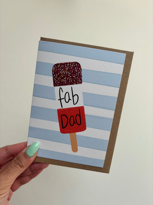A6 card with blue and white horizontal stripes background featuring ice lolly and the word ‘fab dad’. Including brown Kraft envelope.