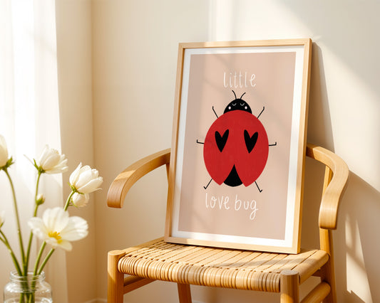 Kids wall art with beige background,  a hand drawn illustration of a ladybird with face and the words “little love bug” In white handwritten text.