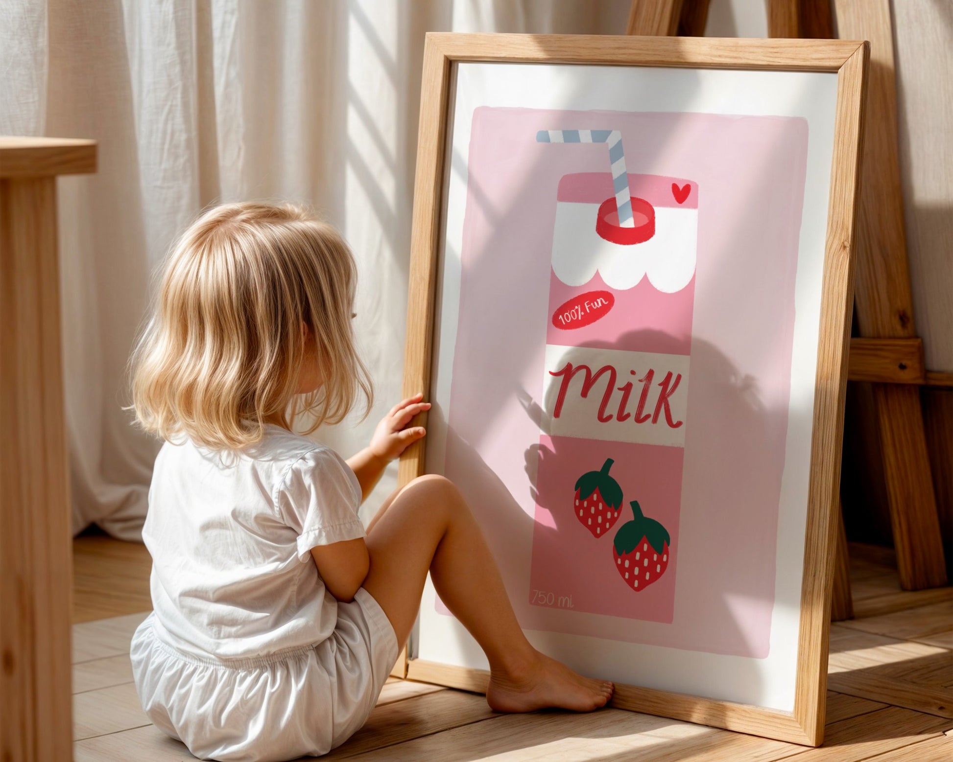 Kids wall art with pale pink background and white border with a strawberry milk carton illustration