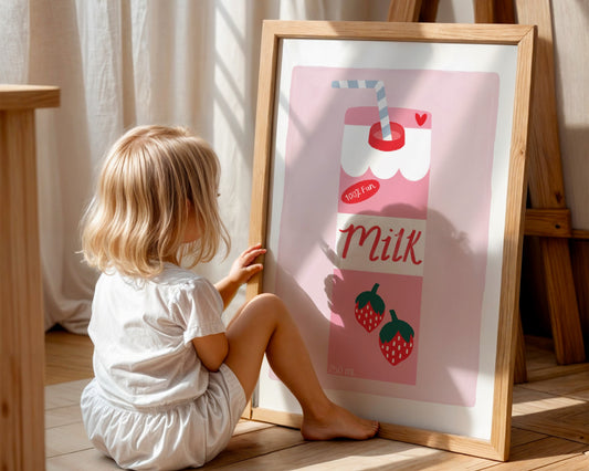 Kids wall art with pale pink background and white border with a strawberry milk carton illustration